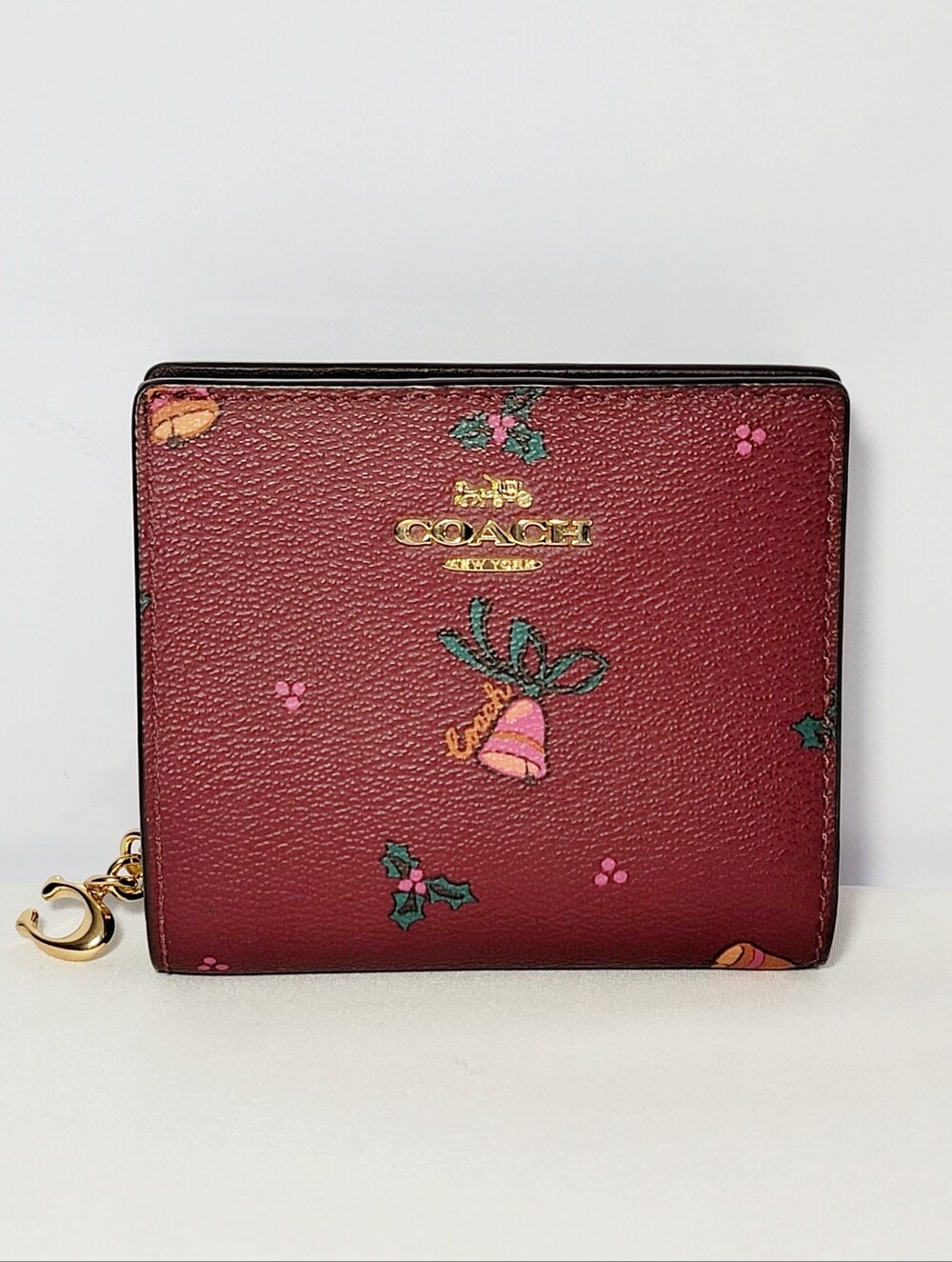 Coach Black Cherry Snap zip Wallet with Holiday Bells.